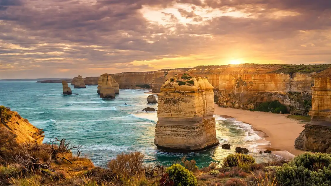 Australia itinerary 2 weeks: Twelve Apostles limestone stacks on the Great Ocean Road at sunset