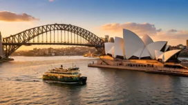 Sydney Opera House and Harbour Bridge at sunset with a ferry in the foreground